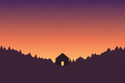 A small mountain hut with a lit window under an orange sunset